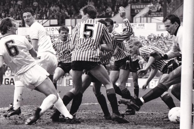 Peter Swan scores the opening goal past a packed Sheffield United defence at Elland Road in March 1988. The Whites won 5-0 which included a hat-trick from John Pearson.