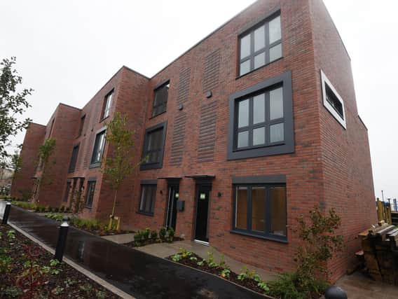 Eight contemporary townhouses including roof terraces, canal-side back gardens and allocated allotment spaces.