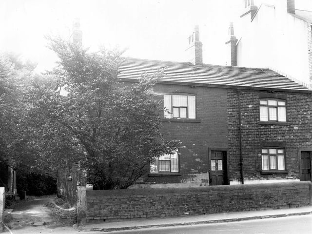 The front entrance and garden of number 189 Tong Road, a through terraced property in September 1972. On the left is an access road to the rear of the properties.