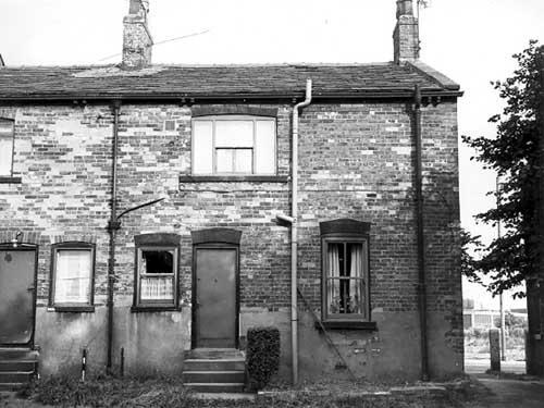 The rear entrance and garden of number 189 Tong Road, a through terraced property in September 1972. Number 191 is visible on the left and on the right Tong Road can be seen.