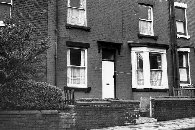 Sixteenth Avenue in October 1971. This is a back-to-back property with a small garden and a bay window. Brickwork has been painted.