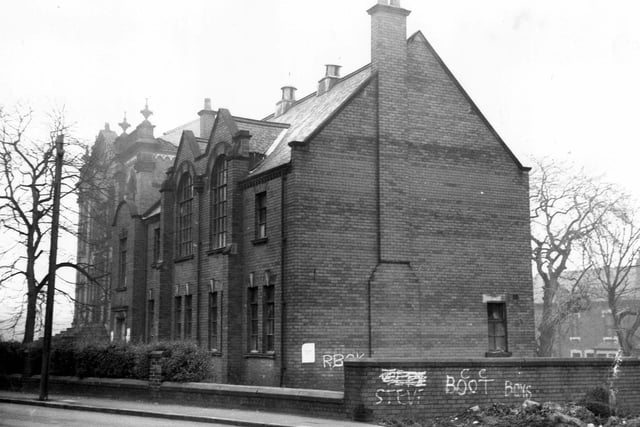 This photo from December 1972 shows a side view of a large building with broken windows once the premises of the Boy's Brigade (27th Leeds Company).