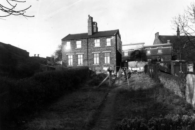 This is the rear view of number 231 Burley Road, a branch of the Leeds Skyrack and Morley Bank. On the right is Willow Road, the Burley Hotel public house can be seen.