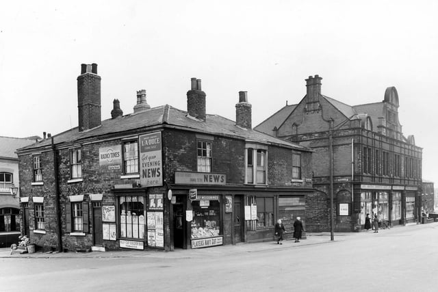 This photo was taken in the late 1950s. The Burley Road branch of the Leeds Industrial Co-operative Society is on the right. On the left edge part of the Sussex Tavern on North Hall Terrace is in view. Newton Street has children sitting on the steps then 2 is next to the newsagents shop.