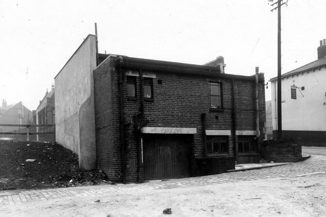Pictured is the rear view of number 231 Burley Road, a branch of the Leeds Skyrack and Morley Bank in December 1959. On the right is Willow Road, the Burley Hotel public house can be seen.