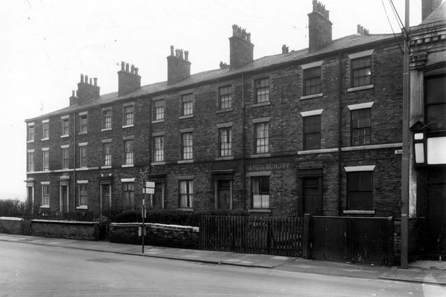 December 1959. Row of ten houses on Burley Road. Number 155 is on the left, this is the junction with Ventnor Street.