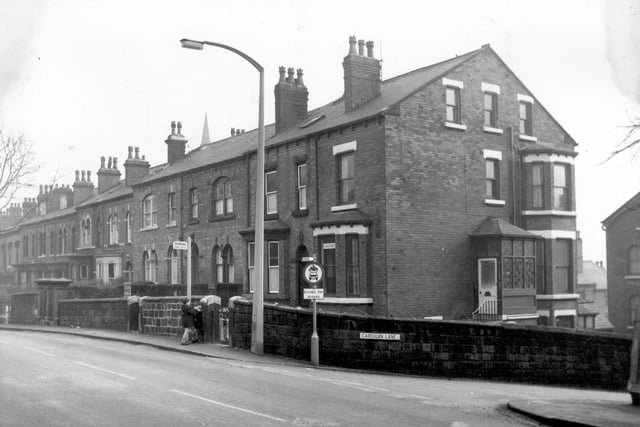 The junction of Burley Road and Cardigan Lane. Properties on the odd numbered side of Burley Road run from the left edge in ascending order to number 305 on the right which is Herbert Tetlow's dentists surgery.