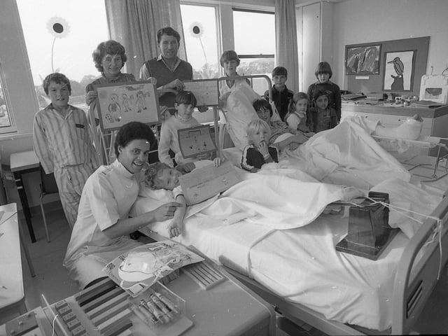 Preston North End players were the ideal judges for a painting competition organised for young hospital patients by Deepdale Radio... for the subject was football. Team captain Don O'Riordan is pictured with some of the children in Royal Preston Hospital who took part