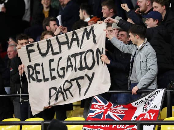 Fulham fans display a banner 'celebrating' their impending relegation during the Premier League match between Watford FC and Fulham FC at Vicarage Road on April 02, 2019.