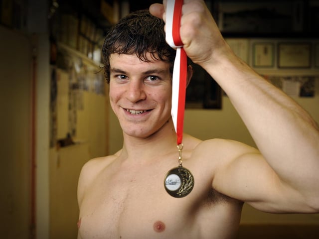 Grappling (sort of wrestling) champ David Shaw with gold medal, at the Dojo, on Falsgrave Road.