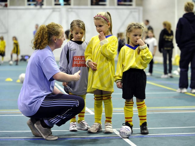 Girls’ Brazilian-style football for year two starters indoors at Bramcote School sports hall.