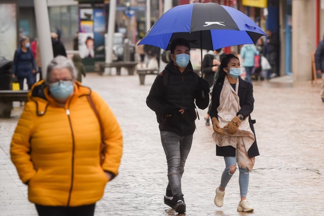 Shoppers took to the streets as normal despite the rain