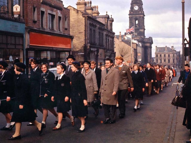 School contingents are seen here in the procession to visit the Queen Street Wesleyan Chapel (later to become Morley Central Methodist Church) for a service of thanksgiving for Morley's 75 years as a Borough.
