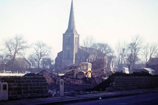 Victoria Road showing the beginnings of the construction of a new garage site. St. Peter's Church is seen in the background.