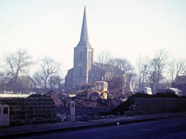 Victoria Road showing the beginnings of the construction of a new garage site. St. Peter's Church is seen in the background.
