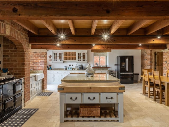 The kitchen makes a feature of the Aga range cooker