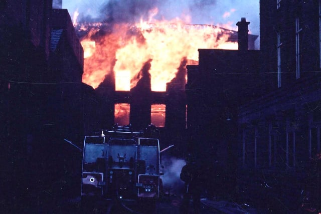 A daylight photograph, somewhat underexposed, of the fire at the Albert Mill which gave rise to the fire of the Town Hall Dome at the same time.