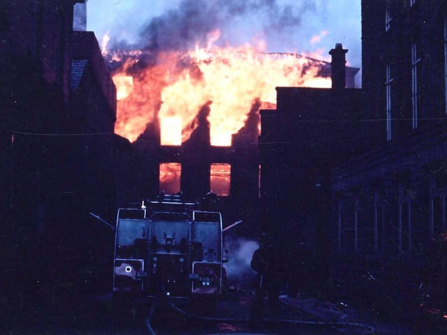 A daylight photograph, somewhat underexposed, of the fire at the Albert Mill which gave rise to the fire of the Town Hall Dome at the same time.