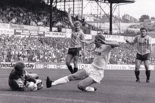 August 1988 and Ian Baird slides in on Oxford United's goalkeeper Peter Hucker during the opening game of the season. The ball went over the line but was disallowed.