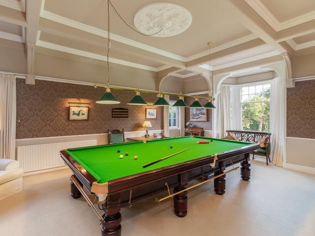 The billiard room is popular with both young and old.