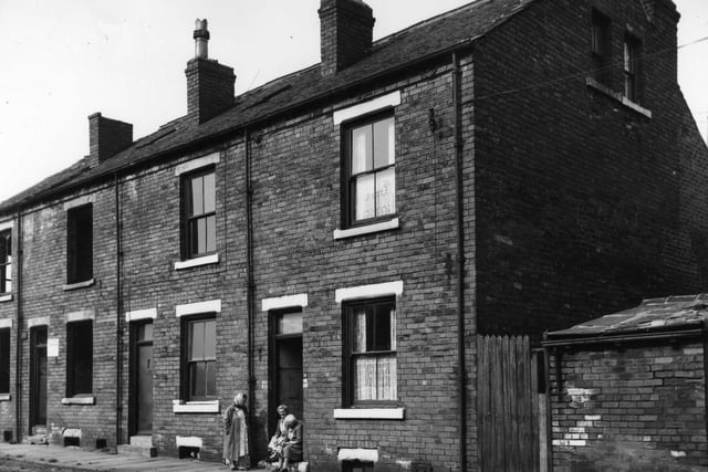 Three back-to-back terraced houses on Berwick Place in September 1964 with a yard on the right originally built to house a shared outside toilet.