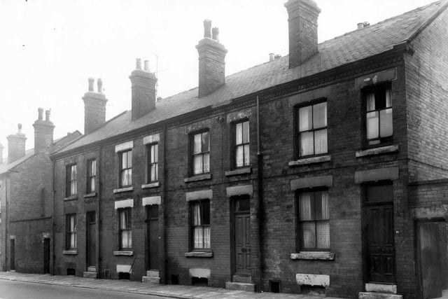 Bower Road in January 1961. An outside toilet block stands on either edge. Included in slum clearance plans for Grove Road area.