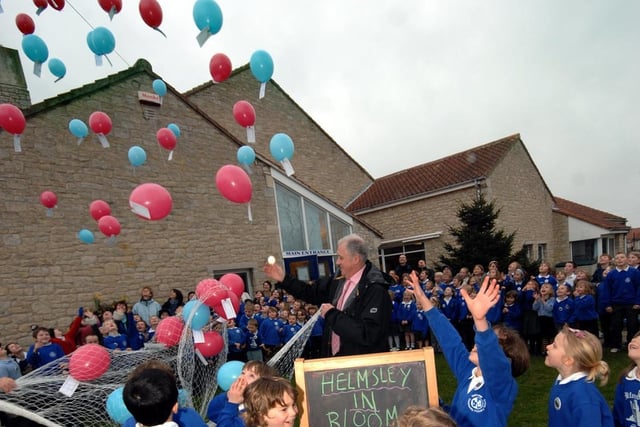Children from Helmsley Primary look as balloons are released by Harry Gration to mark the start of the town's Britain in Bloom entry in 2007..