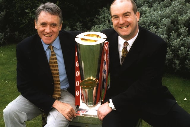 Presenter Harry Gration with match commentator Dave Woods get to grips with the Super League trophy ahead of BBC2's new The Super League Show in May 1999.