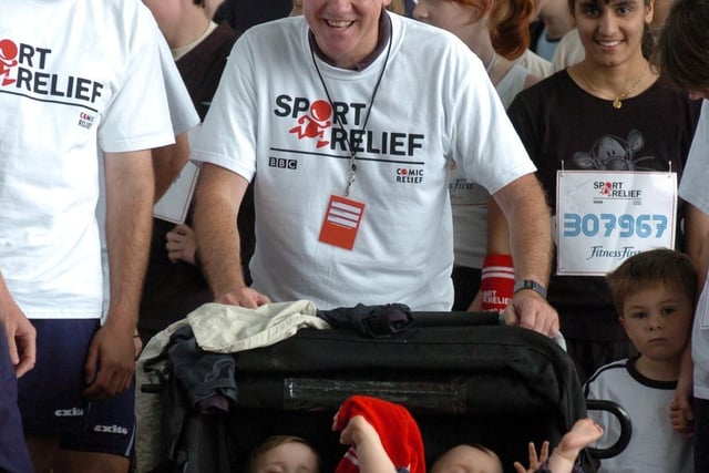 Jukly 2004 and Harry Gration sets off on the Sport Relief Mile in Roundhay Park with his twins.