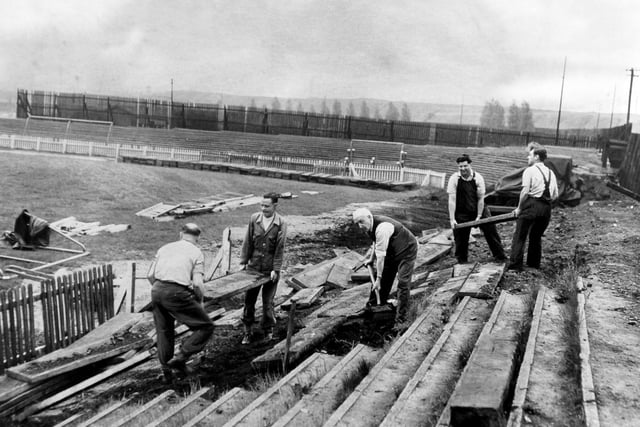 Men at work at Hunslet RL's Parkside ground. They were clearing the terraces at the Mother Benson's end to make the playing area bigger.