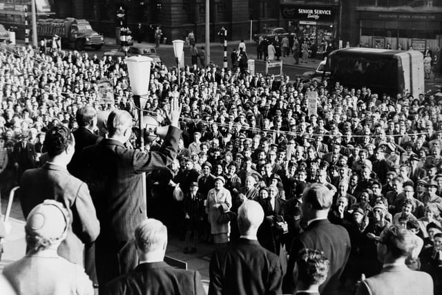 Harold Macmillan raises his hand to emphasise a point in his speech to a large crowd outside Leeds Town Hall in September 1959.
