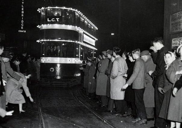 November 1959 and the last tram to run in Leeds enters the depot after its final journey to be met by a large crowd lining the route.