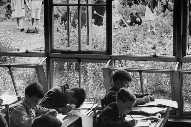 Pupils at South Featherstone Modern School have their heads down over their desks while others are busy in one of the largest school gardens in England.