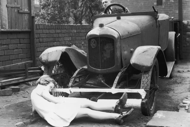 J T Griffin of Castleford in Yorkshire demonstrates his road safety lifeguard which he claims will greatly reduce fatalities on the road. Rollers fitted beneath the radiators of vehicles prevent objects from going underneath the car.