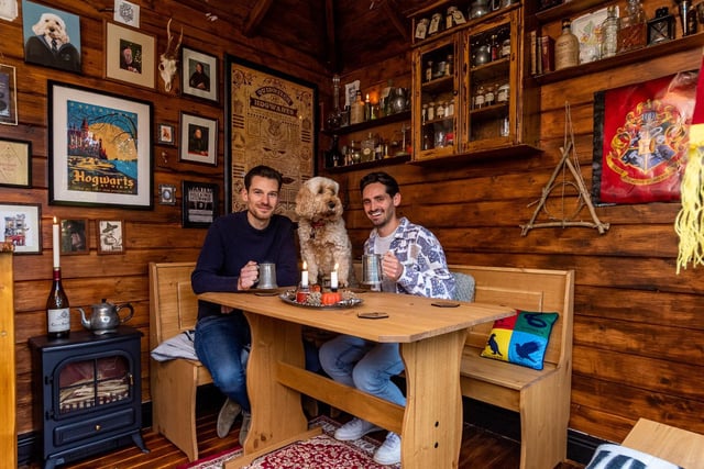 Mark Parkinson and partner Dan Harrison, pictured with dog Hugo, decided to turn their Thorner summerhouse into The Leaky Cauldron.