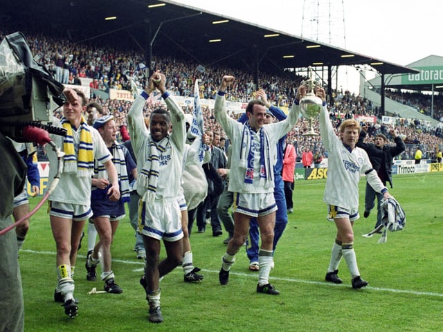 Gary McAllister and his Leeds United team-mates parade the First Division trophy around Elland Road after beating Manchester United to the title.