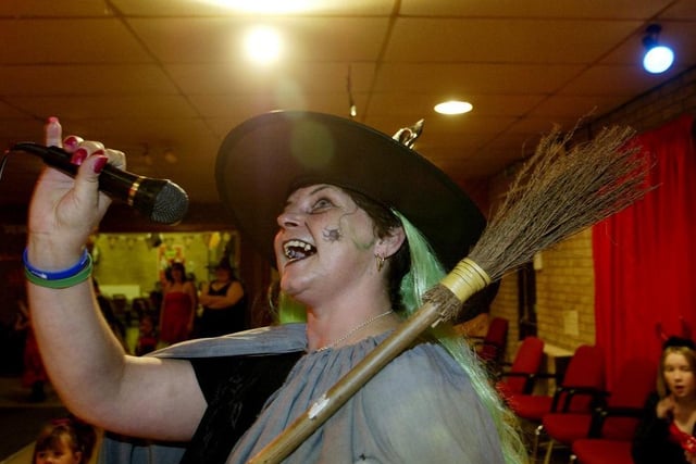 May Hardcastle goes through her routine at the Field Lane Community Centre, Rastrick, Halloween karaoke in 2005.