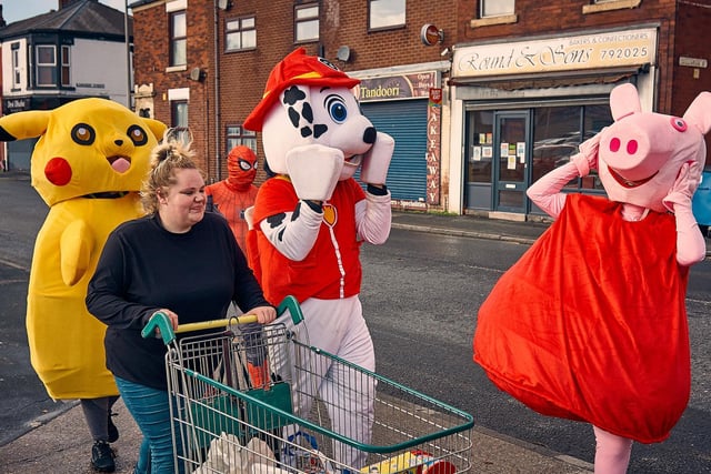 Spirits were high as they dashed down Ribbleton lane with trolleys collecting food