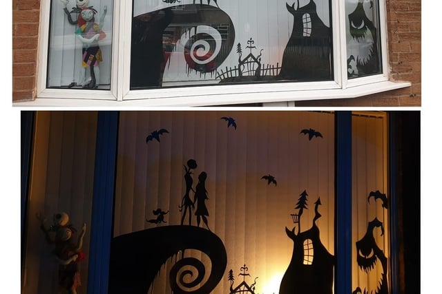 Hand-cut figures made by Hayley Cutler and her family make a very effective window display