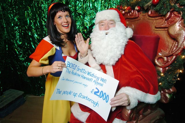 2006, and his ninth year as Santa at Boyes ... Alan presents a cheque for £2,000 to Children in Need from the Andrew Hansell Appeal, collected by Snow White (Emma Payne)