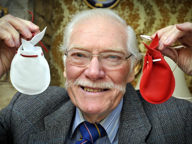 Alan holds the Maundy money pouches, presented to him by the Queen at The Royal Maundy ceremony at York Minster in 2012