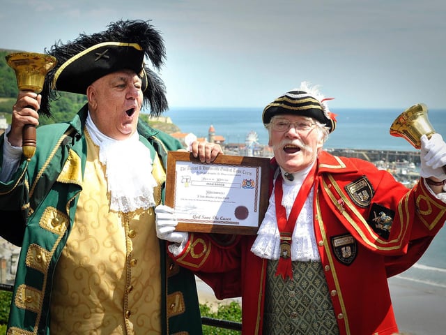 Alan retires as town crier in 2015, and is presented with a scroll by Bridlington town crier David Hinde