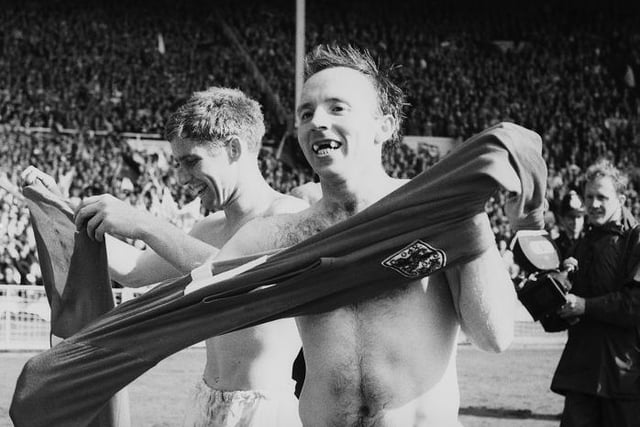 Team mates Alan Ball, left, and Nobby Stiles celebrate after England's victory in the 1966 World Cup final at Wembley, 30th July 1966