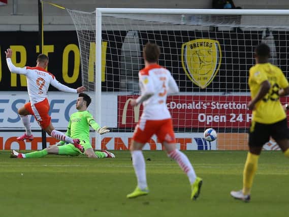 Jerry Yates slots home for the first of his two goals at the Pirelli Stadium