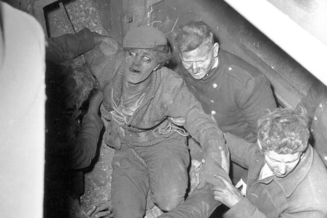 Lance Ash is rescued from a 130ft chimney at Mark Rowlands furniture warehouse on East Street in April 1964. He had been trapped for six hours while clearing bricks during the demolition.