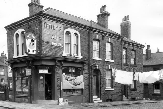 Corner terraced houses on Acton Street at the junction with Kiln Street in Beeston in July 1964. The shop is licensed to sell groceries. It is on Kiln Street at number 20.