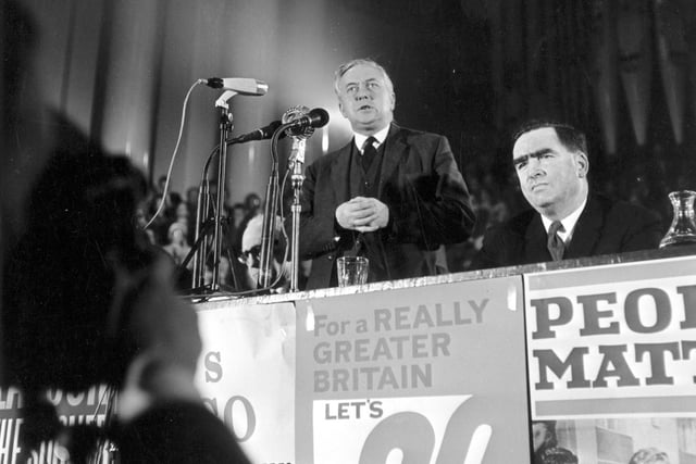 Harold Wilson MP and Labour opposition leader, addressing an election campaign meeting at Leeds Town Hall in February 1964. Dennis Healey MP for Leeds North East is sitting to the side of him. Labour won the election in the October.