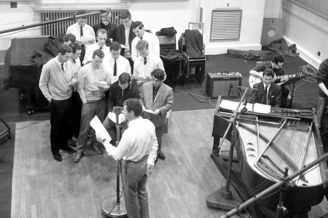 Leeds United players in a recording studio with Ronnie Hilton in April 1964. Their record, the Leeds Calypso, was later released as a single.