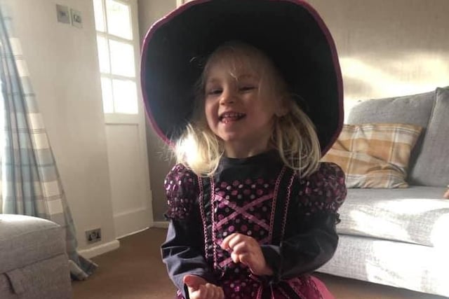 Charlotte Anderton (two) as a witch