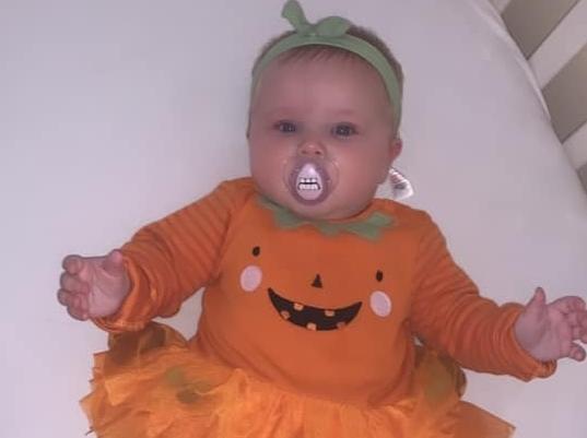 Six month old Bella Grace makes an adorable pumpkin